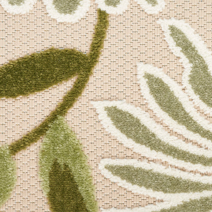 Olive-green leaf outdoor rug with white edging on a beige woven base; botanical, textured, 8' x 11'.