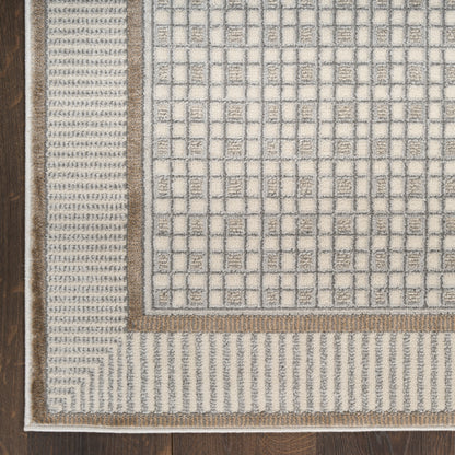 Rectangular woven area rug in ivory with a geometric grid pattern, tan borders and textured edge on dark wood floor.