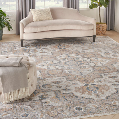 Beige vintage area rug with ornate beige-blue pattern, 9' x 12'.
