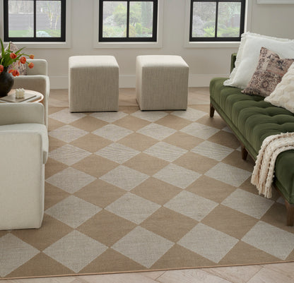 Cozy living room with a tan-cream checkered rug, cream seating, two beige ottomans, and a green velvet sofa with pillows.