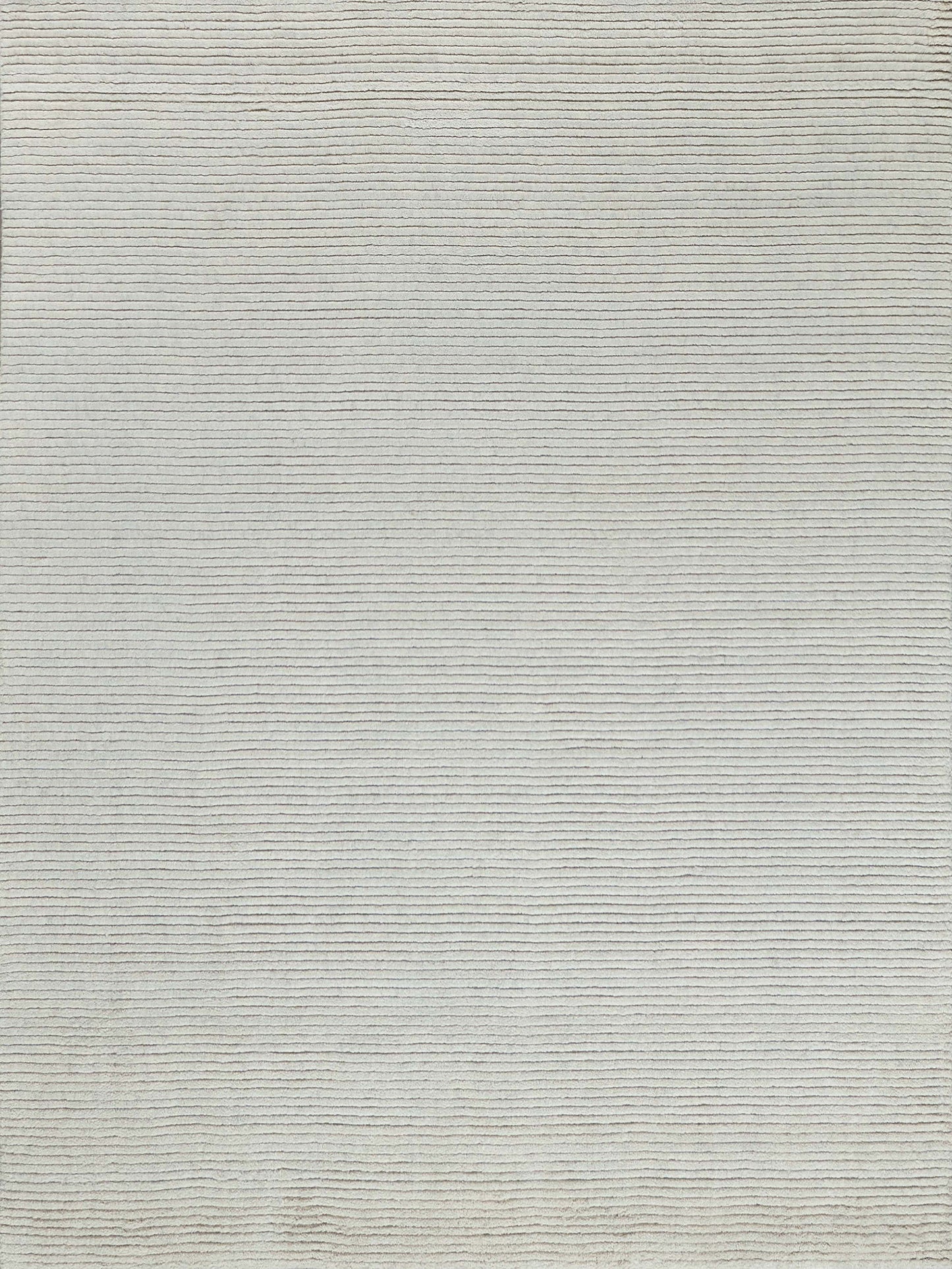 Beige woven rug with subtle horizontal stripes; soft texture for living room decor.