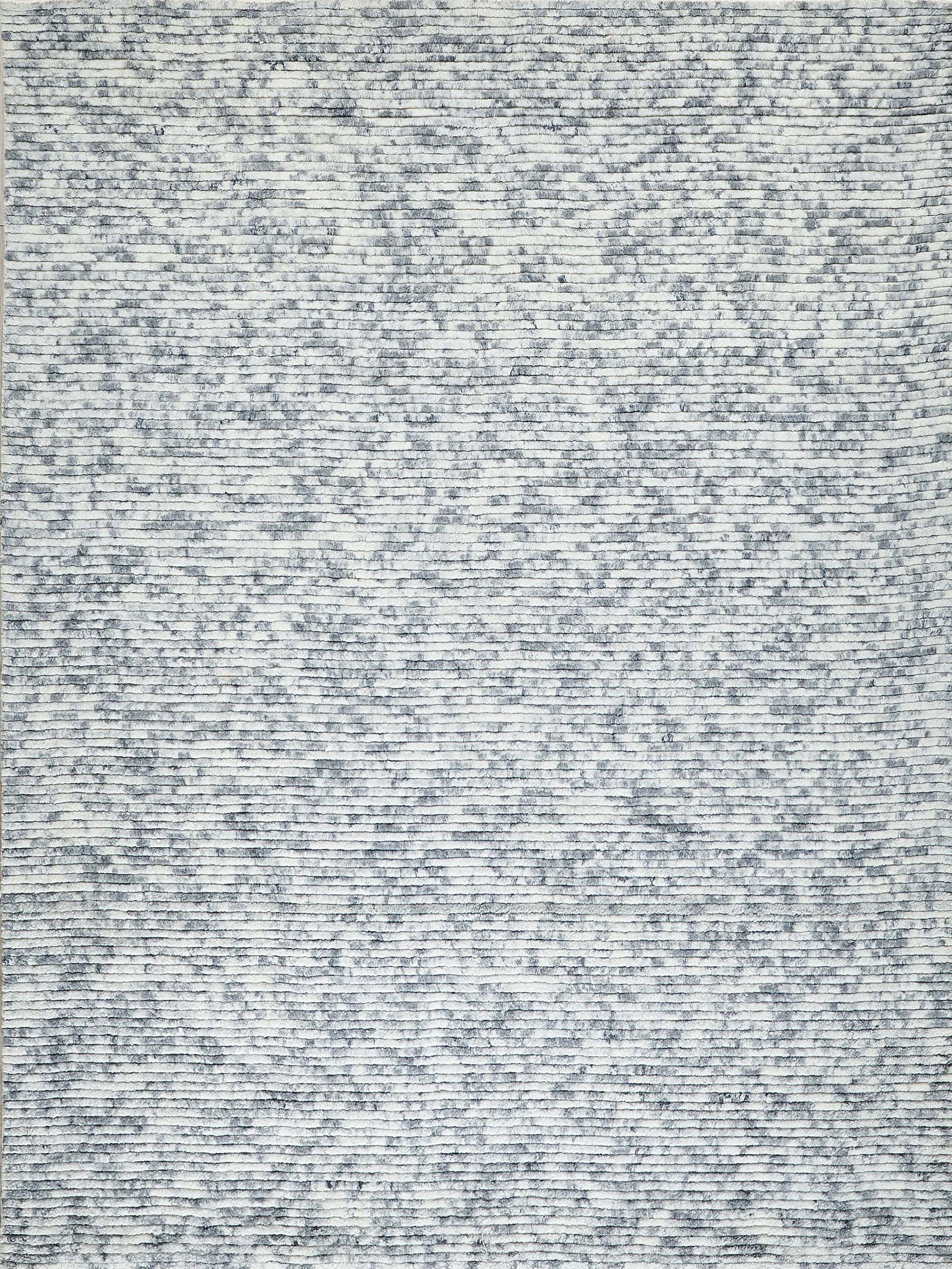 Blue-gray speckled hand loomed rug with heathered texture; modern casual area rug.
