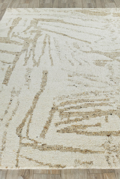 Rectangular beige indoor hand-knotted rug with abstract taupe lines, modern geometric pattern and soft textured pile.