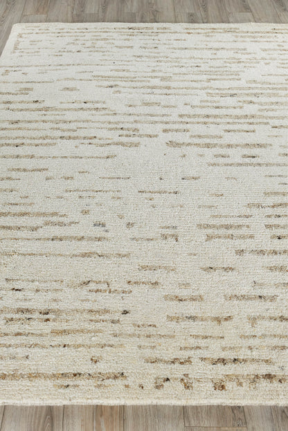 Cream rectangular area rug with light tan abstract dash pattern; soft plush texture, modern distressed style for living room.