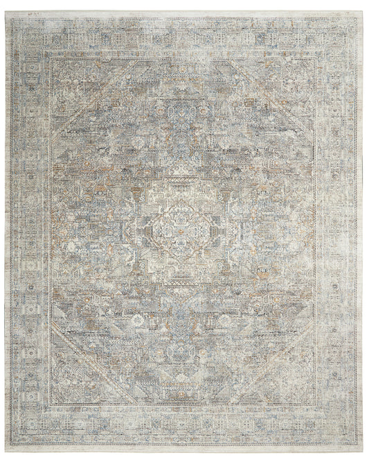Rectangular distressed blue-gray oriental rug with central medallion, ivory floral motifs, and multiple borders.