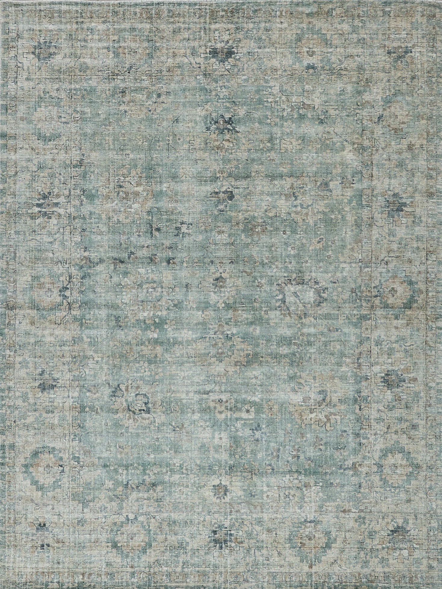 Distressed teal-blue area rug with faded floral medallions and beige accents; rectangular, vintage oriental-inspired decor.