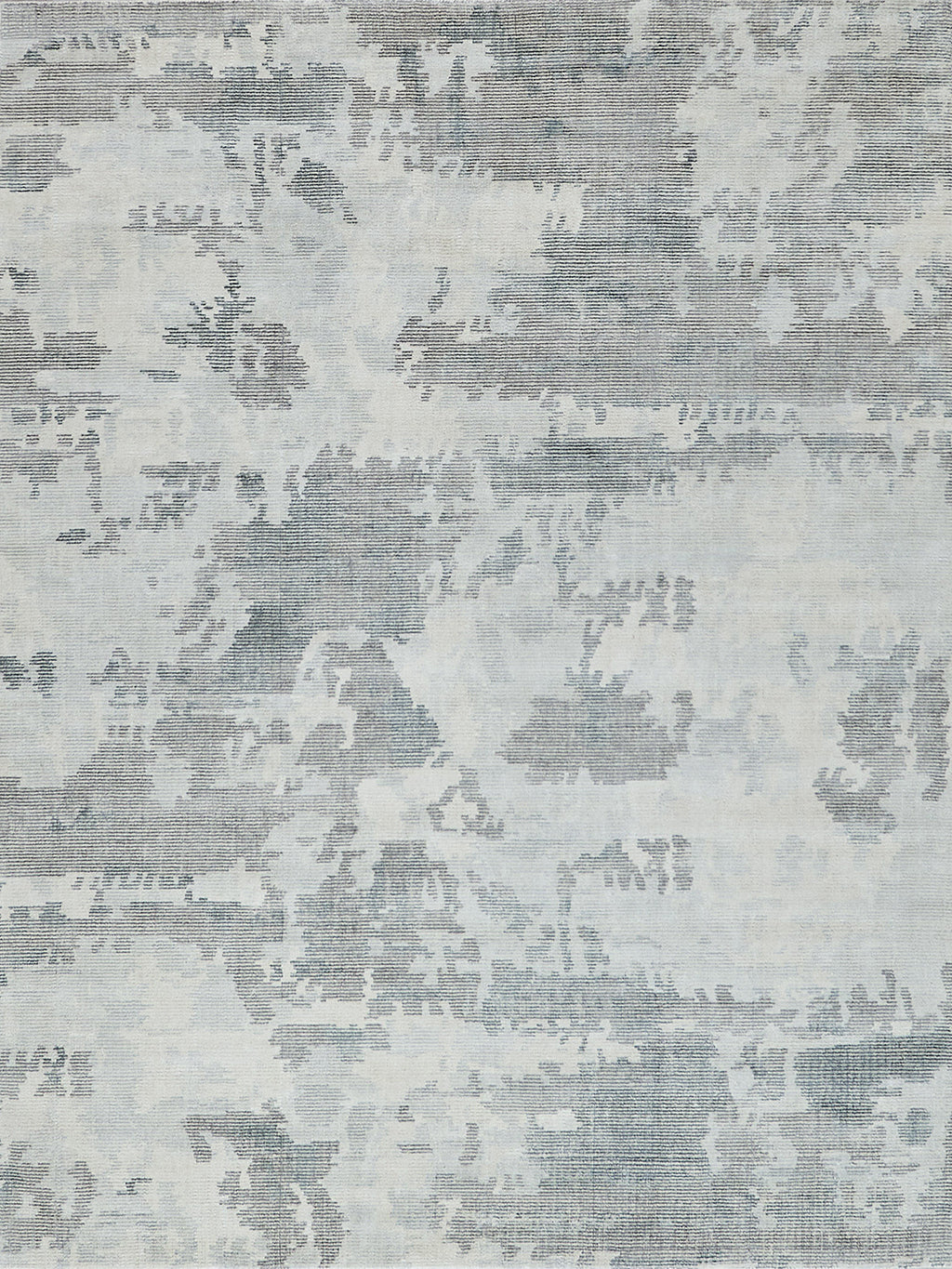 Blue-gray patterned area rug with a faded damask motif and woven texture for a modern vintage living room.