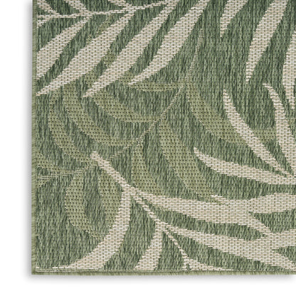 Olive green and beige botanical leaf woven fabric with textured jacquard pattern, ideal for upholstery.