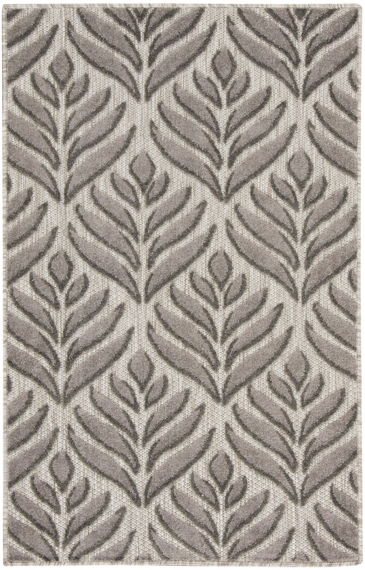 Taupe and beige woven rug with a repeating fern-like leaf pattern and textured surface.
