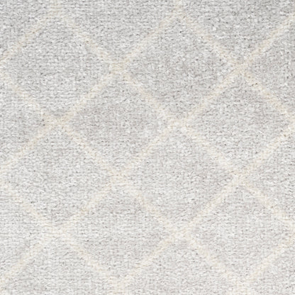 Light gray rug with a subtle diamond trellis pattern and soft plush texture.