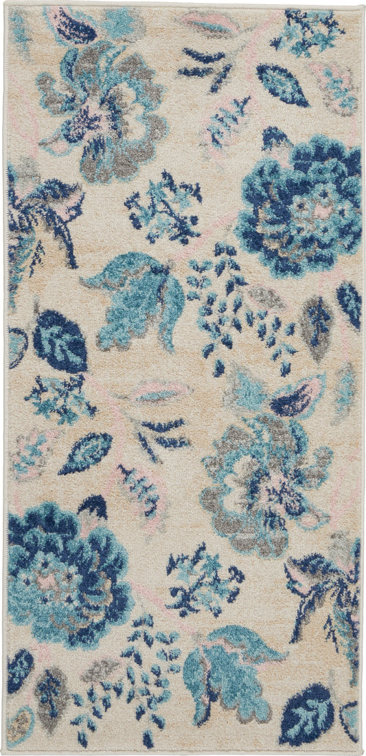Rectangular plush area rug with beige background and blue-teal floral pattern; soft tufted pile ideal for living room decor.