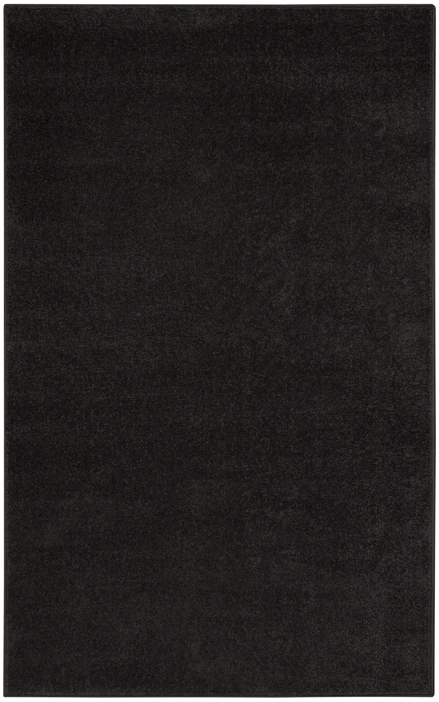 Black rectangular rug with dense plush pile; minimalist floor covering.
