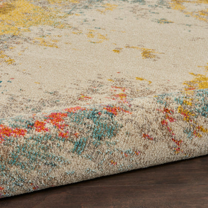 Beige plush rug with abstract multicolor accents in teal, yellow, pink and orange; rolled edge on dark wood floor.