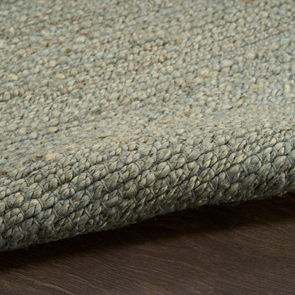 Grey-blue speckled loop-pile rug with braided edge; sturdy woven texture for living rooms.