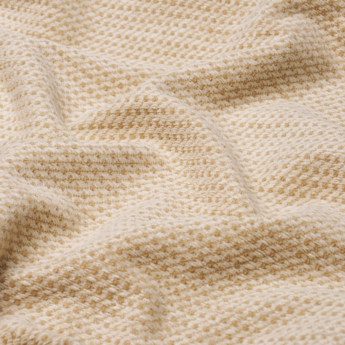 Ivory chenille fabric close-up, plush, soft and cozy texture.