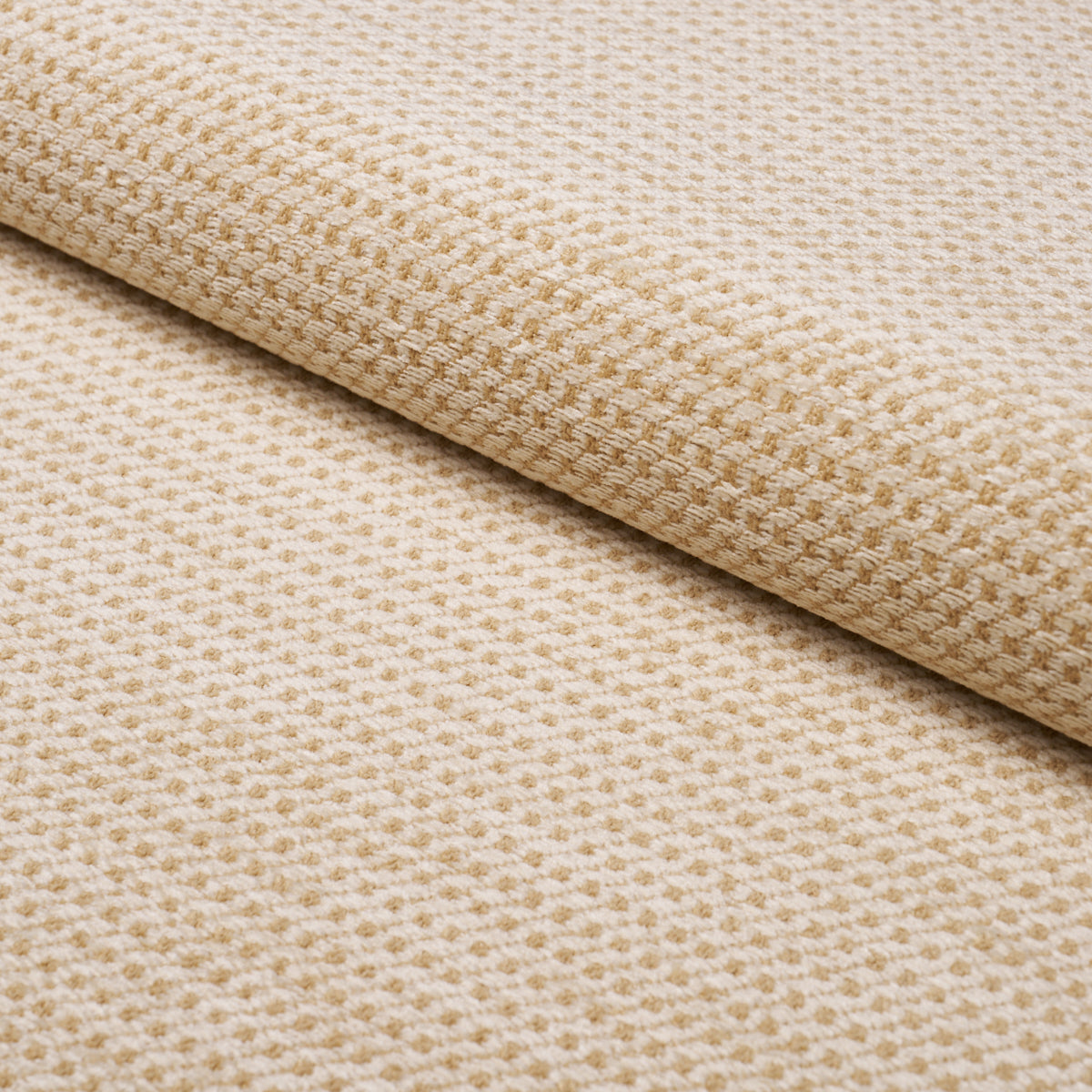 Beige waffle-weave fabric roll with subtle grid texture; soft, versatile upholstery or home textile.