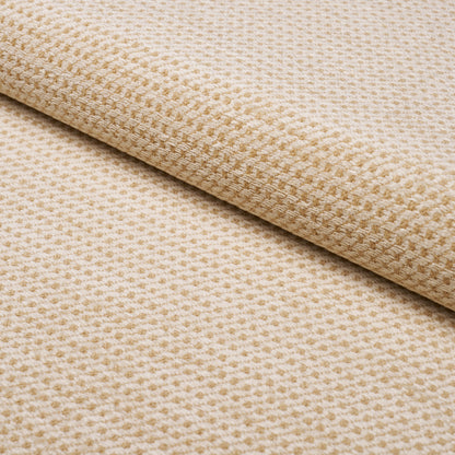 Beige waffle-weave fabric roll with subtle grid texture; soft, versatile upholstery or home textile.