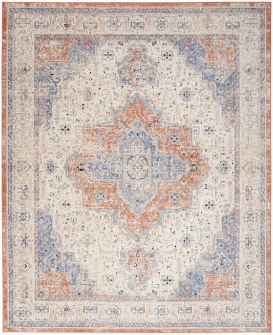 Distressed ivory Persian-style area rug with blue and rust central medallion and ornate floral border.