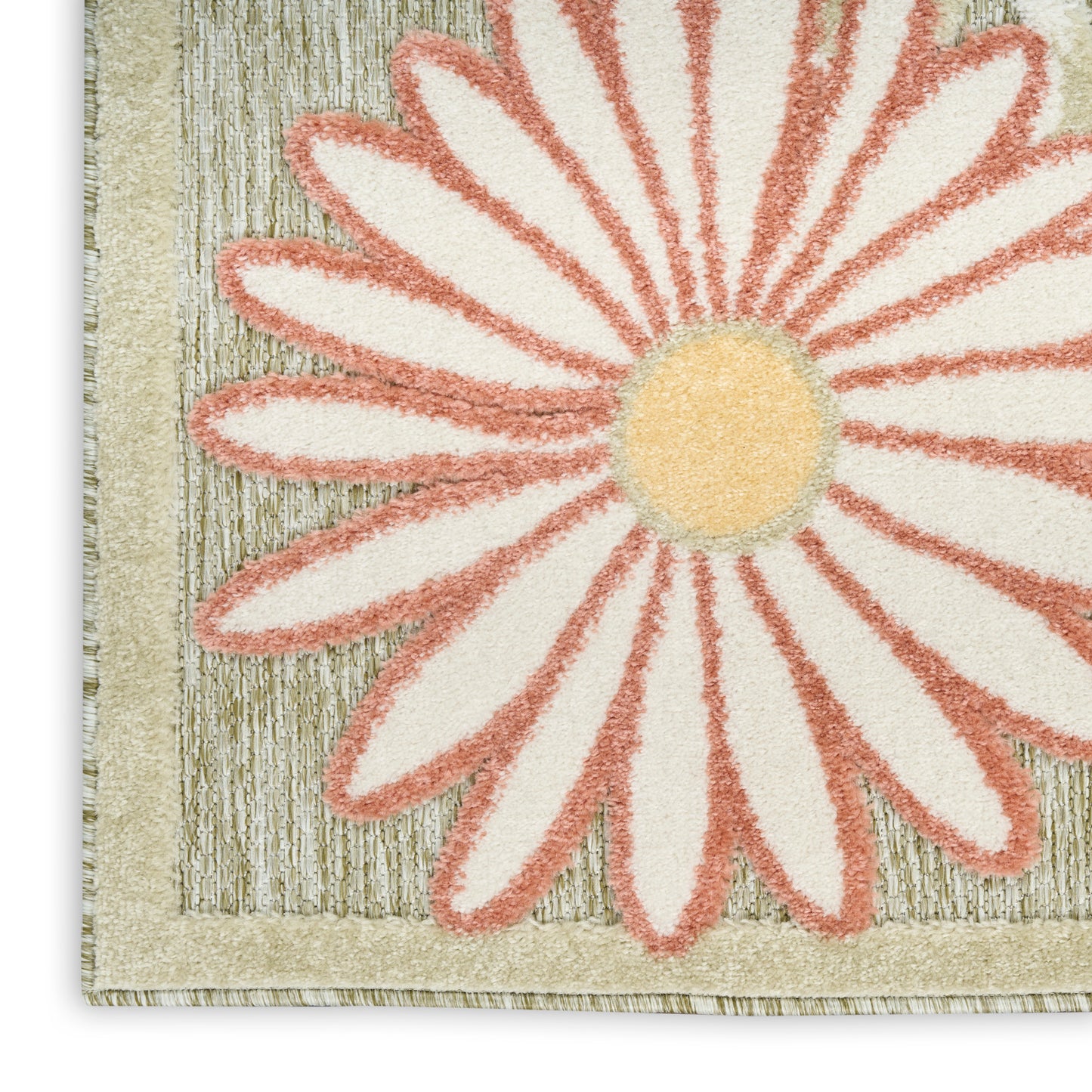 Close-up of a textured rug with a large pink daisy, cream petals, yellow center, and beige woven border.