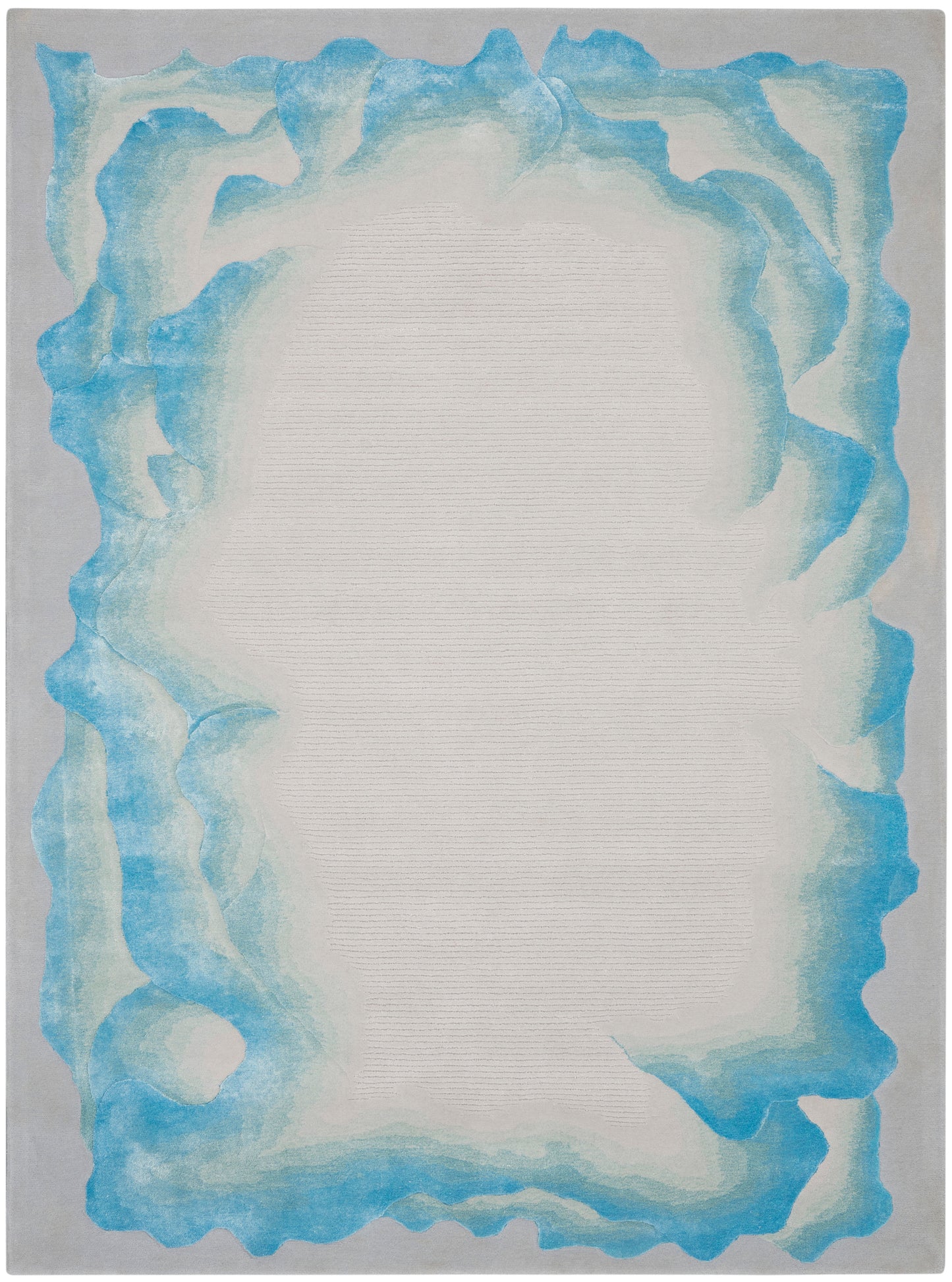 Rectangular flat-weave rug with pale beige inner field and irregular turquoise-blue border.