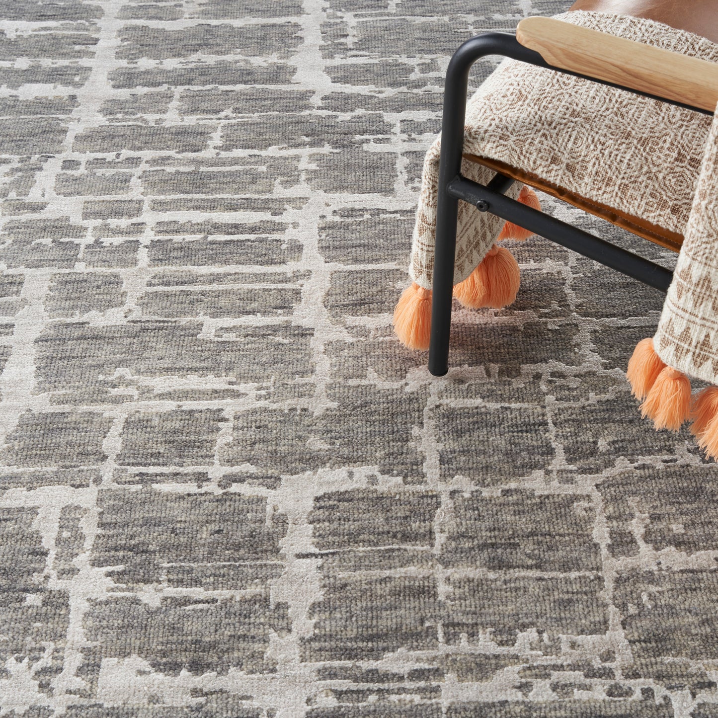 Gray geometric rug with white grid pattern; 10' x 14' rug