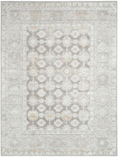 Muted gray-beige oriental rug with a distressed floral lattice pattern and ornate bordered frame.