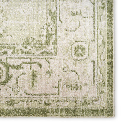 Cream and sage green oriental rug with a distressed floral pattern, plush pile, rectangular shape for living spaces.