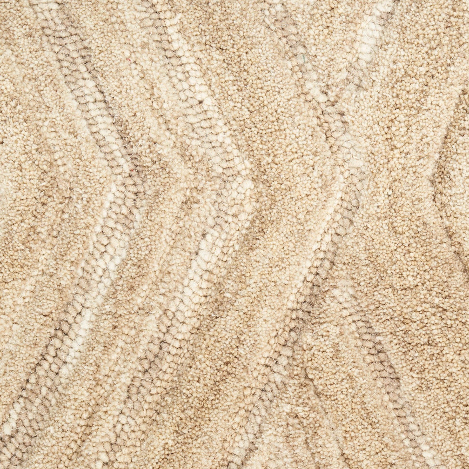 Beige textured rug with soft loop pile & subtle chevron wave pattern.