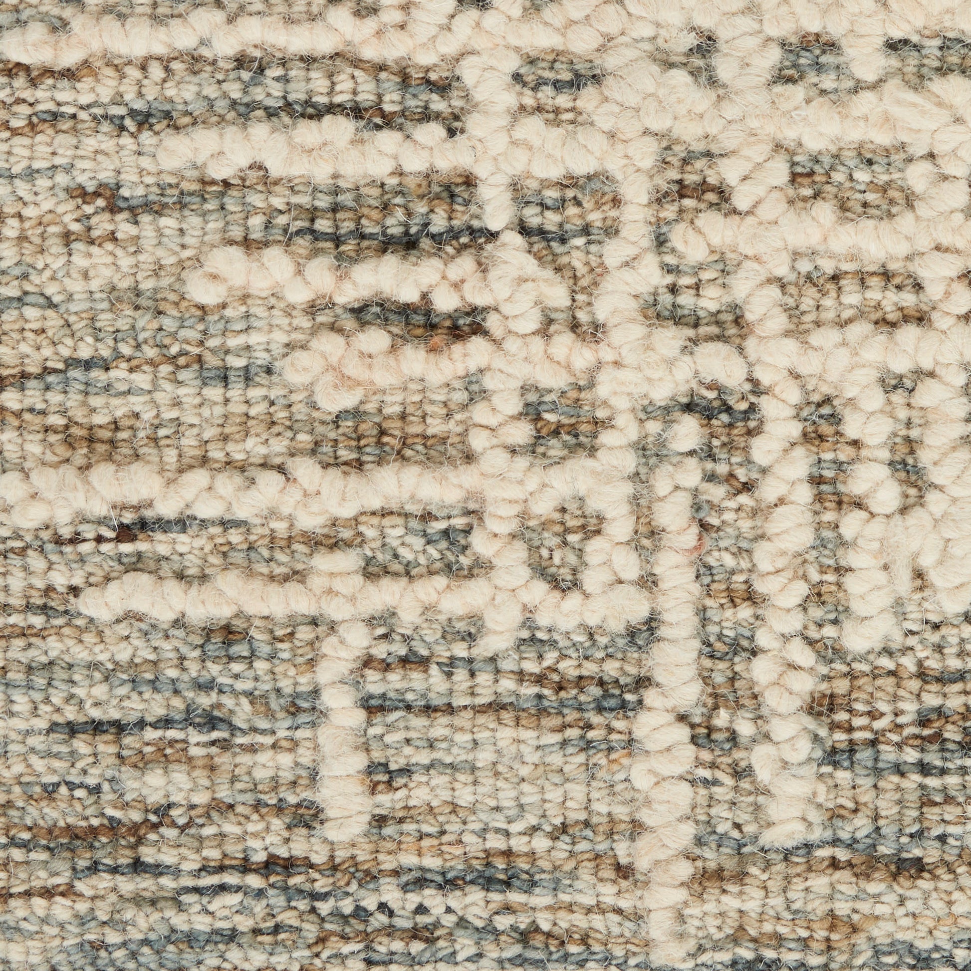 Beige & gray textured woven rug close-up with looped pile & abstract geometric motif.