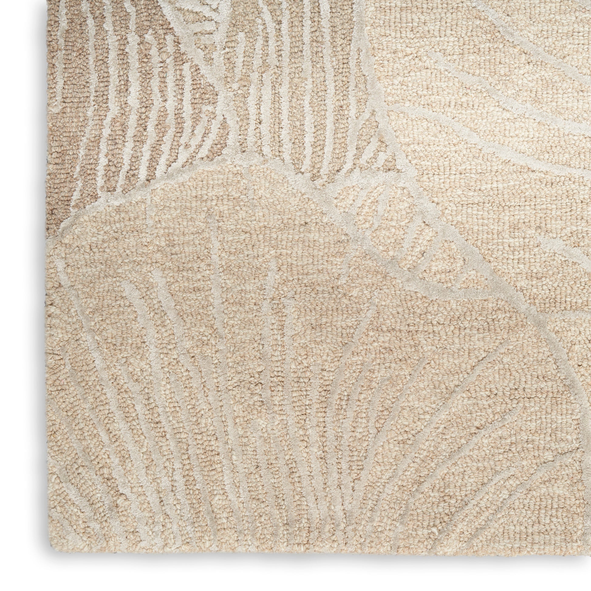 Beige textured rug with cream botanical leaf pattern and soft loop pile.