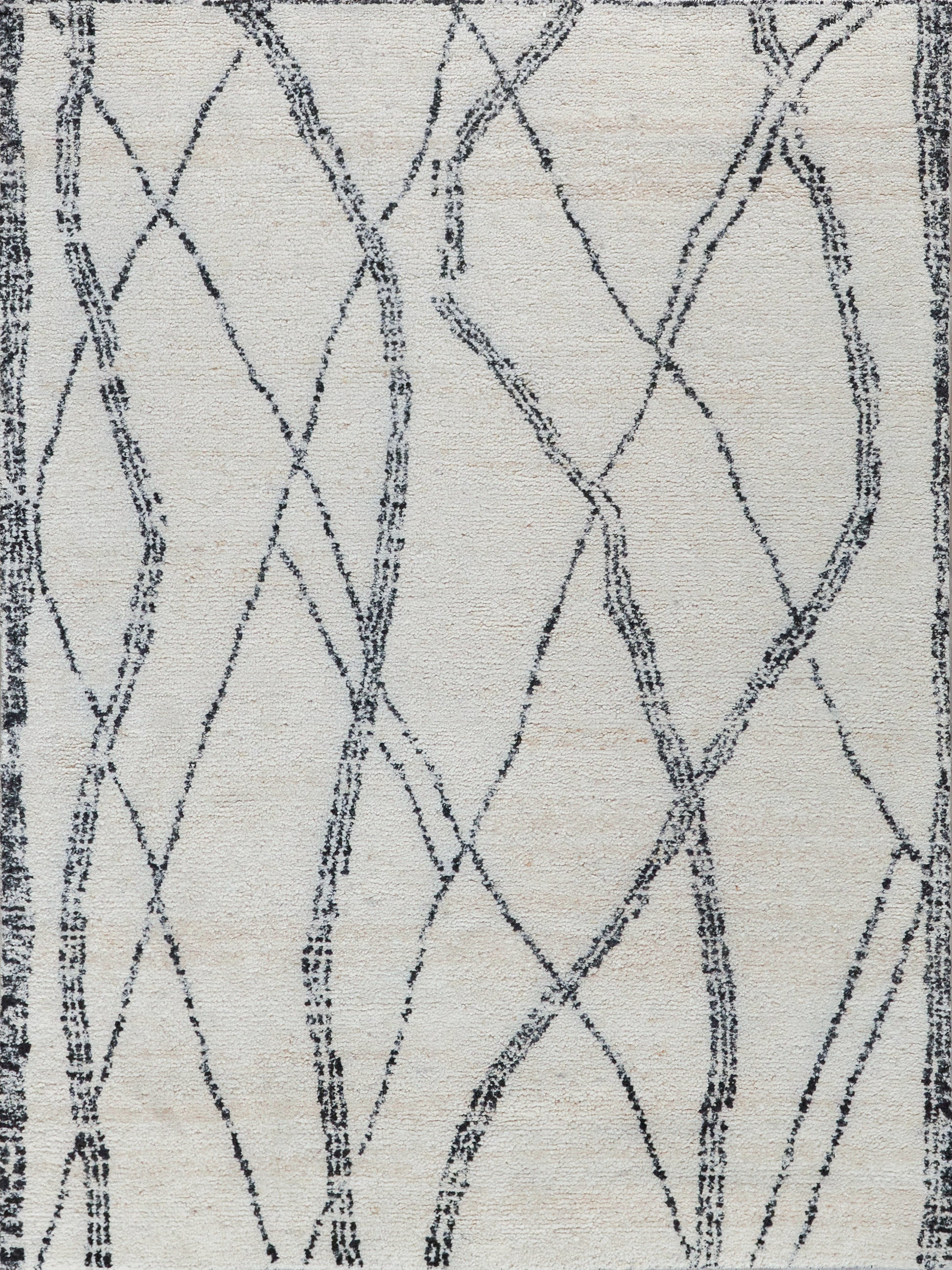 Cream rug with navy crisscross lattice pattern & dark border, modern abstract woven textile.