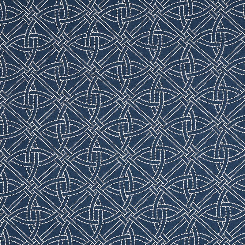 Navy blue fabric with a white dotted interlaced knot pattern, textile texture.