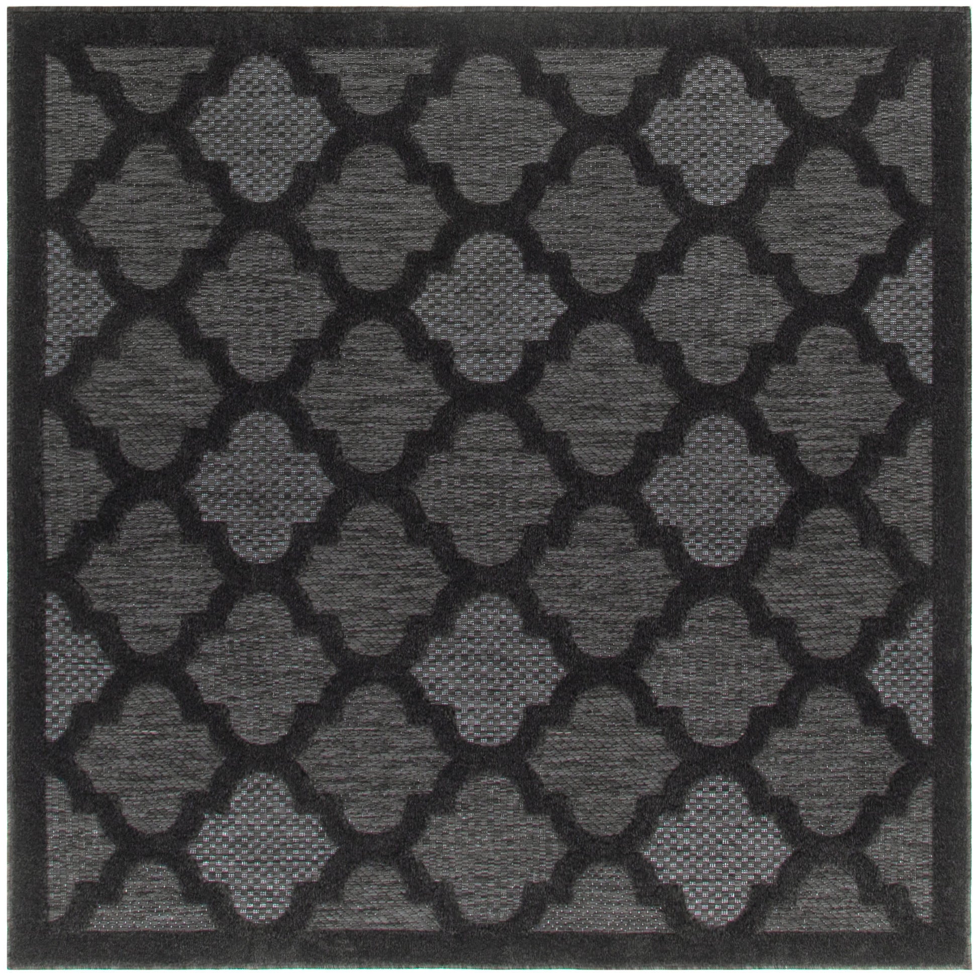 Charcoal gray rectangular rug with a black quatrefoil lattice pattern; textured, suitable for indoor or outdoor use