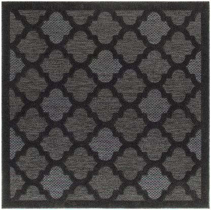 Charcoal gray rectangular rug with a black quatrefoil lattice pattern; textured, suitable for indoor or outdoor use