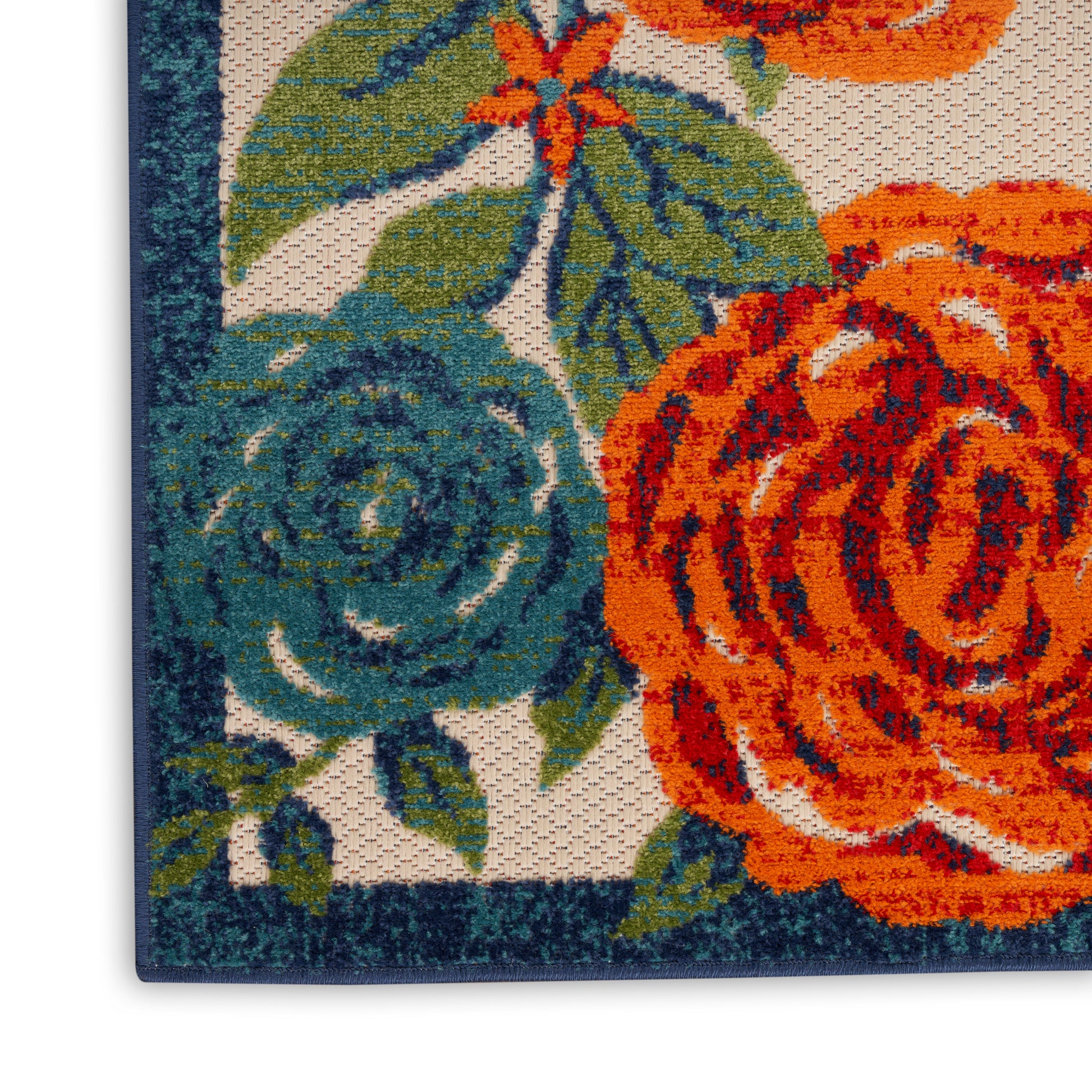 Outdoor rug with a floral pattern featuring orange & teal roses, green leaves, and a dark blue border (6' x 9').