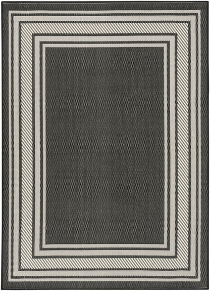 Rectangular black and white rug with layered nested borders and diagonal-striped edges; modern geometric design