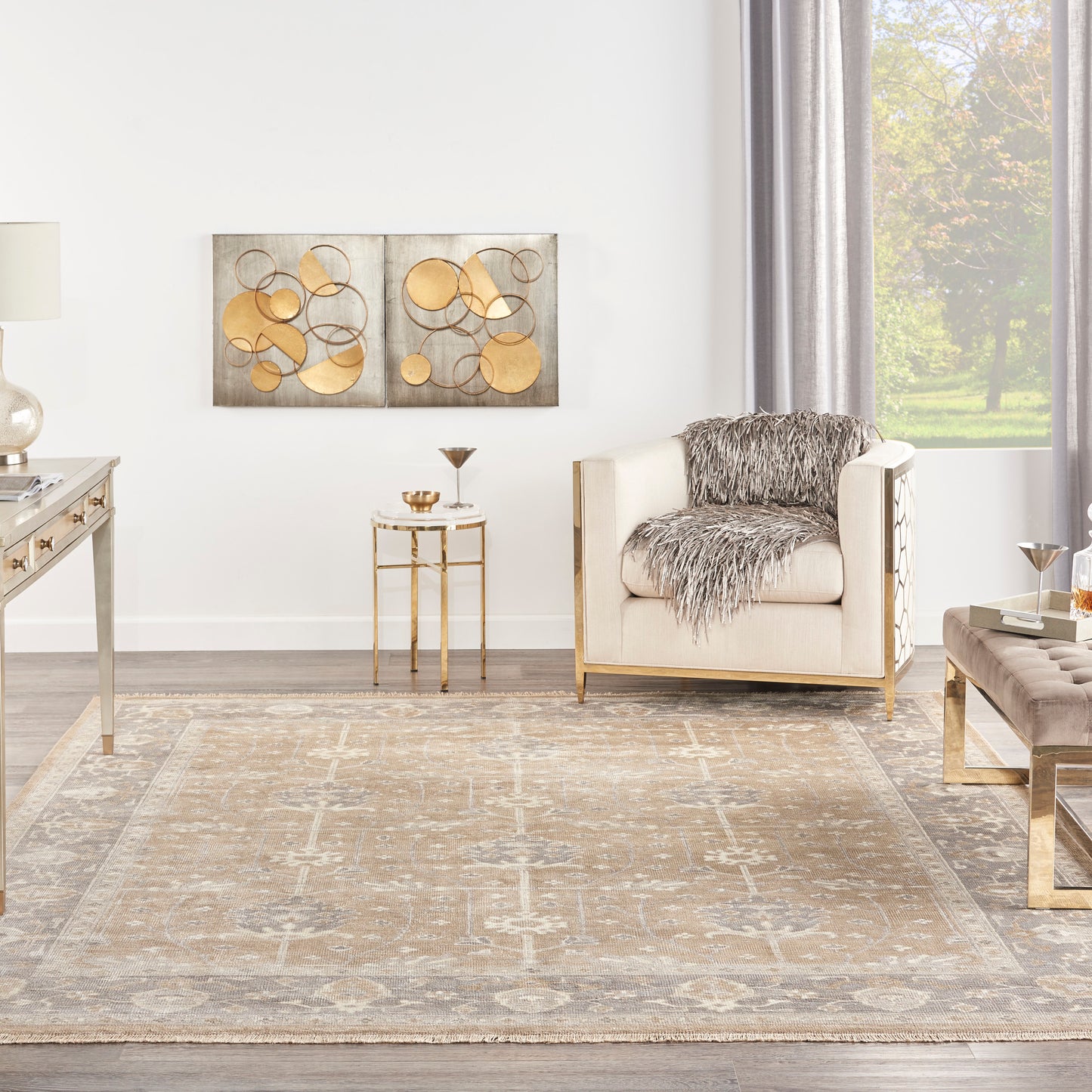 Beige vintage 9' x 12' rug with a muted pattern.
