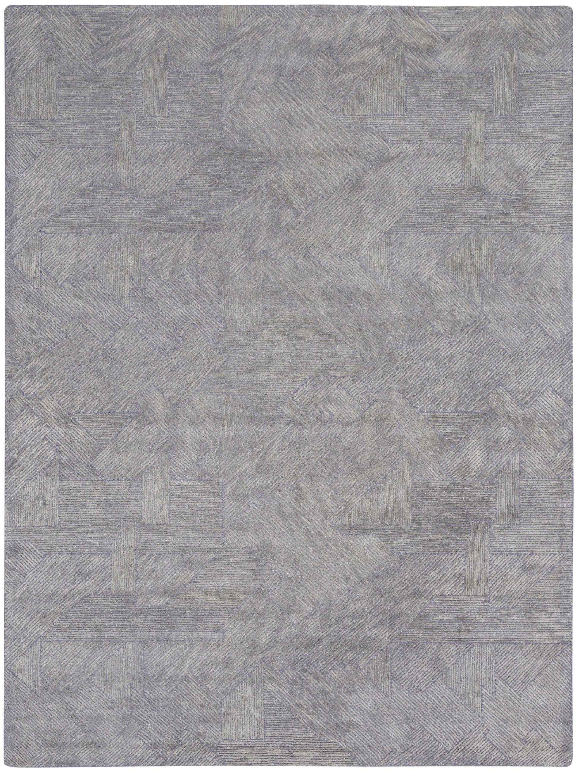 Grey-blue textured rug with a geometric patchwork of rectangular blocks and linear patterns.