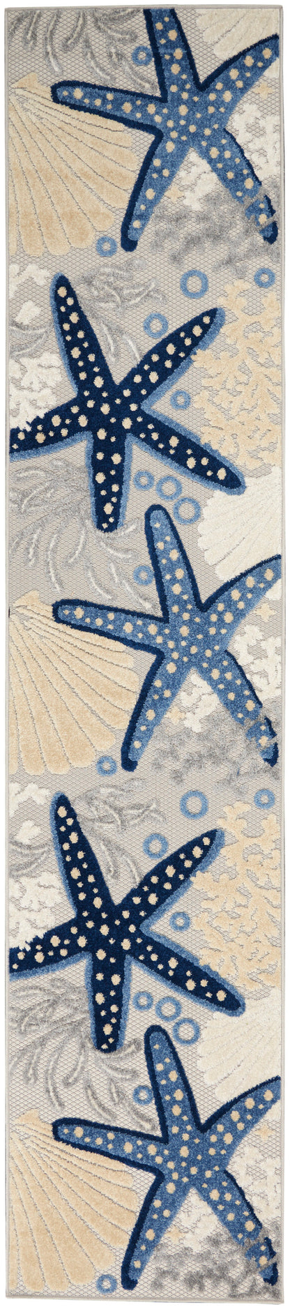 Beach-themed runner rug with navy-blue starfish, pale shells and circles on a light gray background.