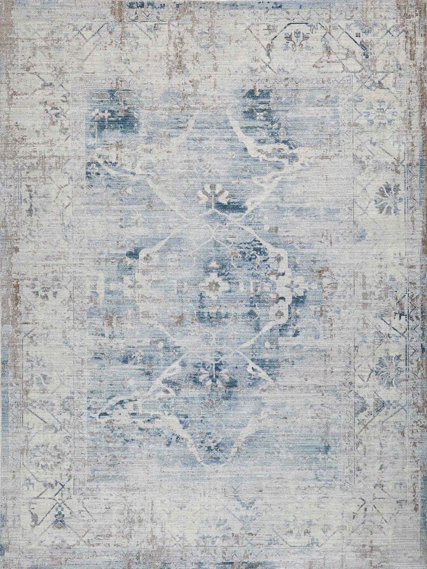 Distressed blue and ivory area rug with faded medallion geometric pattern and vintage oriental charm.