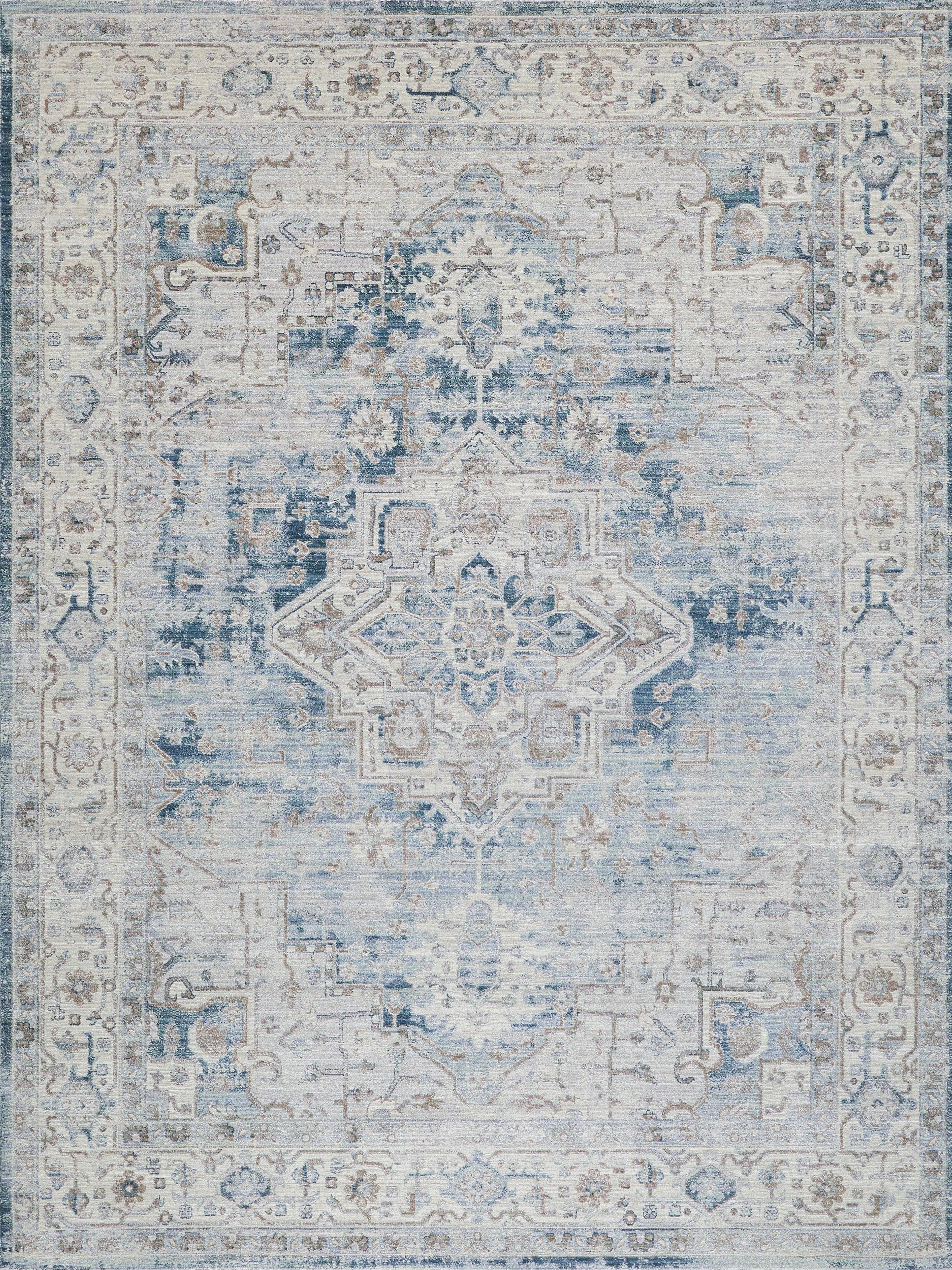 Distressed blue and ivory oriental rug with central medallion and ornate floral border.