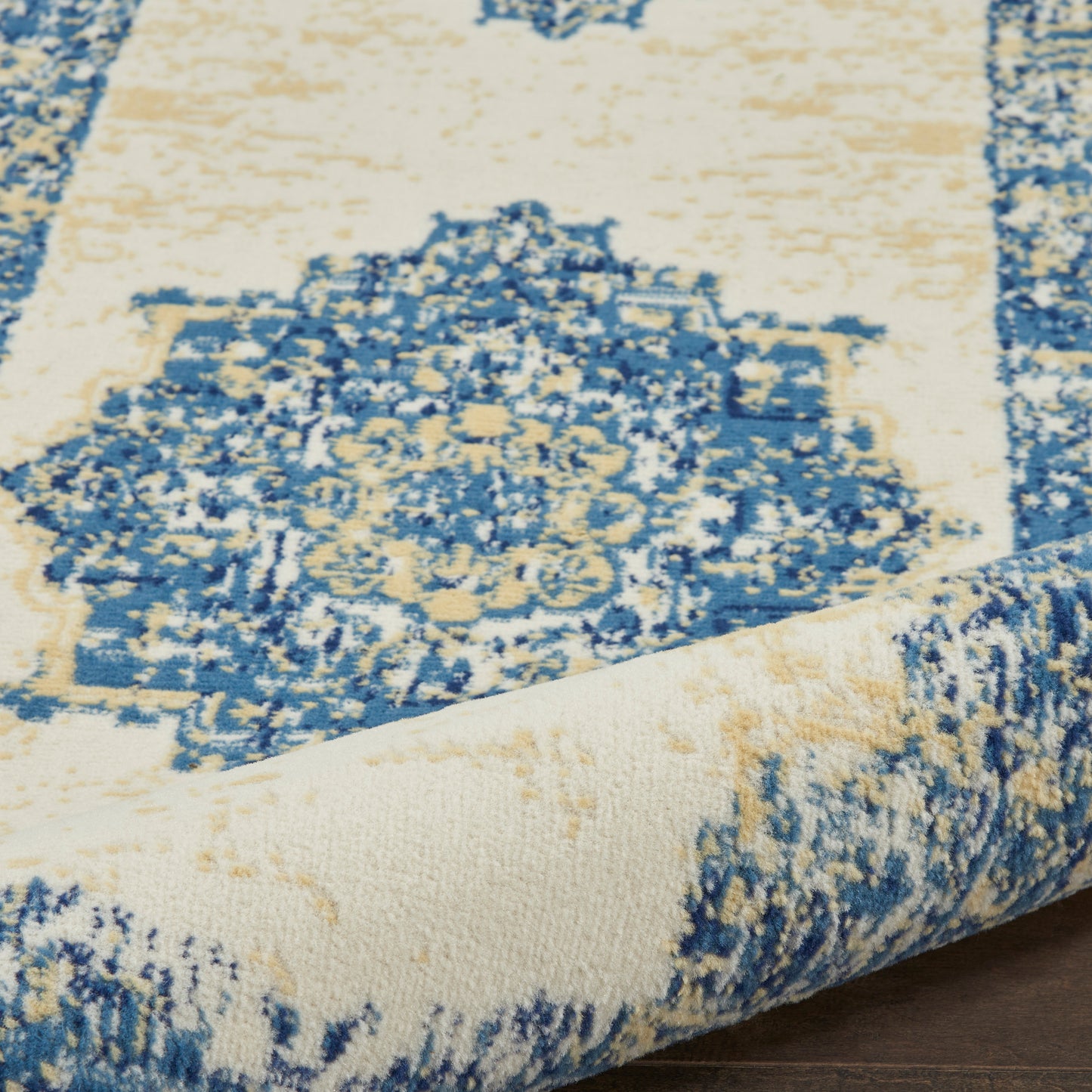 Blue & ivory distressed oriental runner rug with central medallion & ornate border, soft pile.