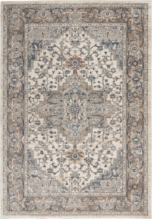 Persian-style ornate area rug with cream field, blue-gray floral medallion & tan border.
