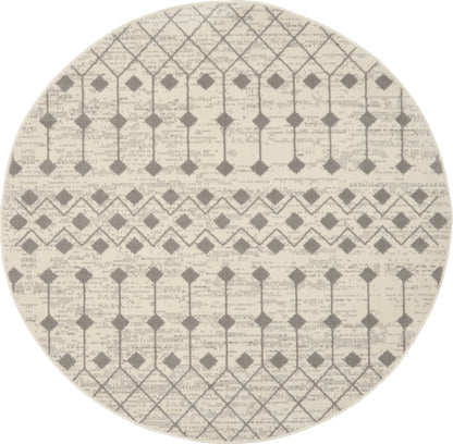 Round beige rug with gray geometric lattice and diamond patterns; woven texture.