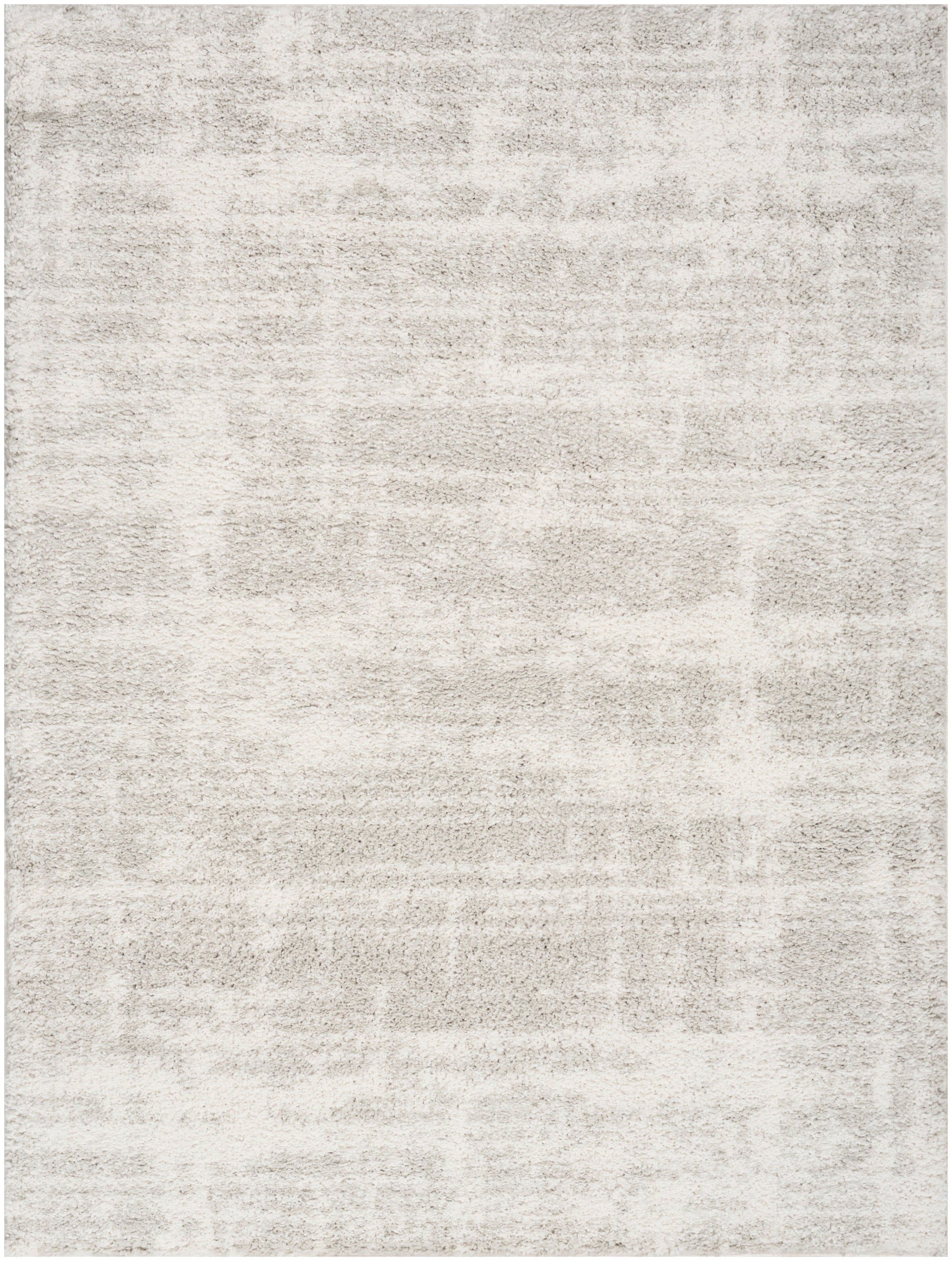 Rectangular cream and taupe rug with a soft plush pile and subtle distressed pattern.