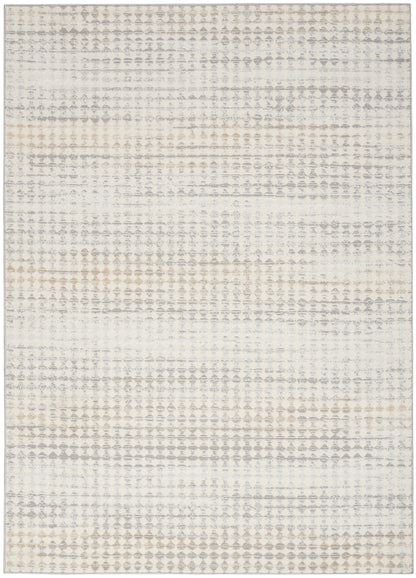 Neutral-toned area rug with a soft gray-beige geometric dot pattern on cream; distressed modern boho style.