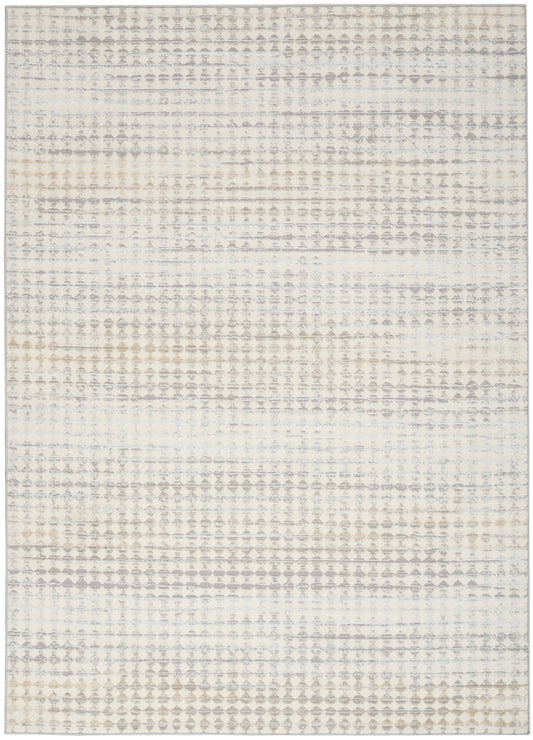 Neutral-toned area rug with a soft gray-beige geometric dot pattern on cream; distressed modern boho style.