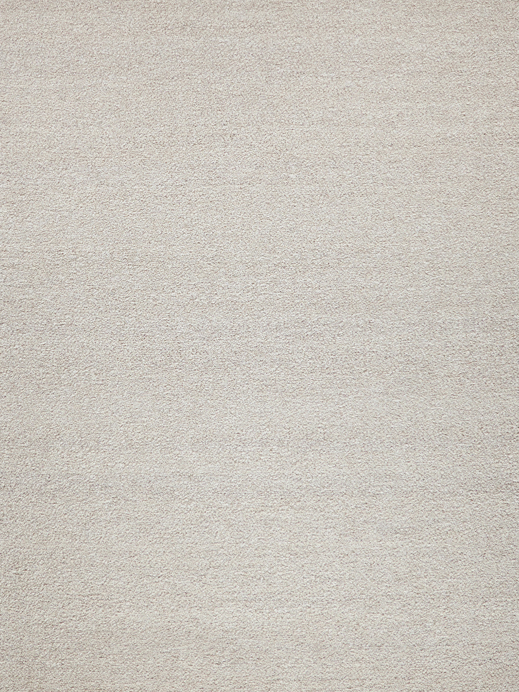 Beige textured rug with soft, looped pile in neutral tan.
