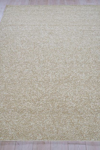 Beige high-pile shag rug in cream tones on light wood floor; rectangular living room area rug.
