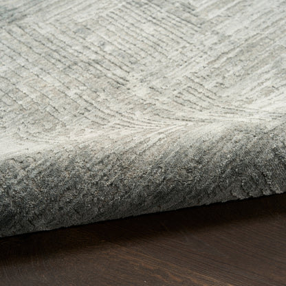 Rectangular gray area rug with subtle raised geometric pattern, low-pile plush, modern living room accent.